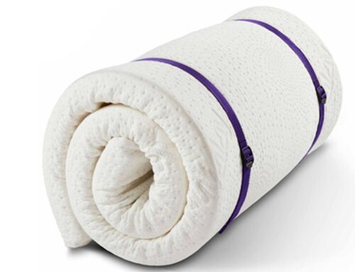 A Rolled Up Memory Foam Mattress Topper Ready For Storage